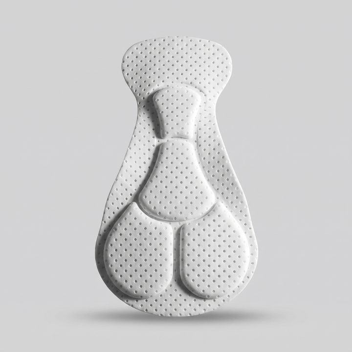 The molded gel chamois pad showing its contoured shape and perforated surface