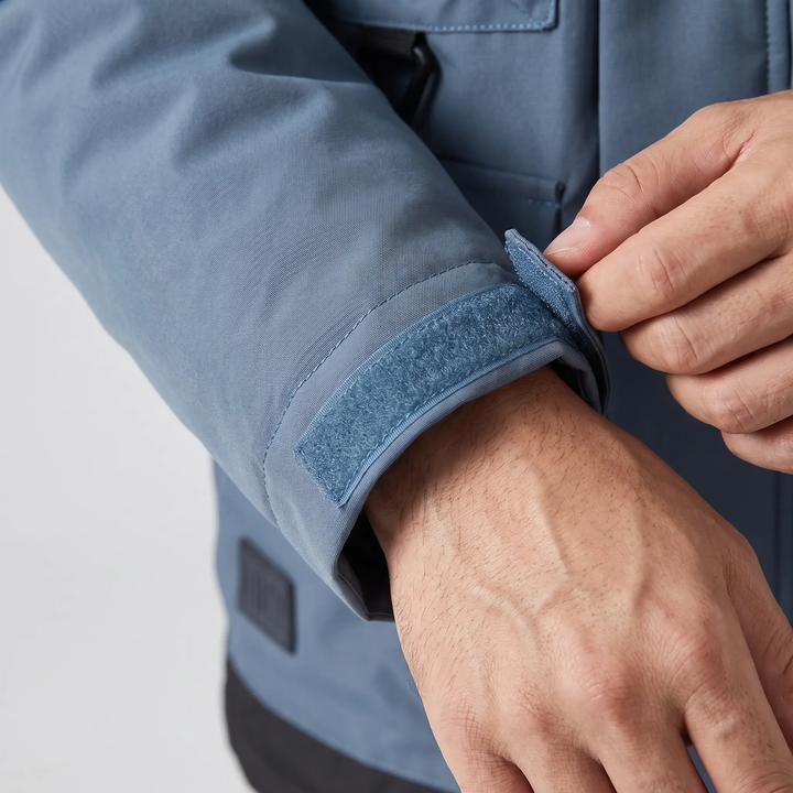Hook-and-loop cuff tab on a men's windbreaker jacket, close-up