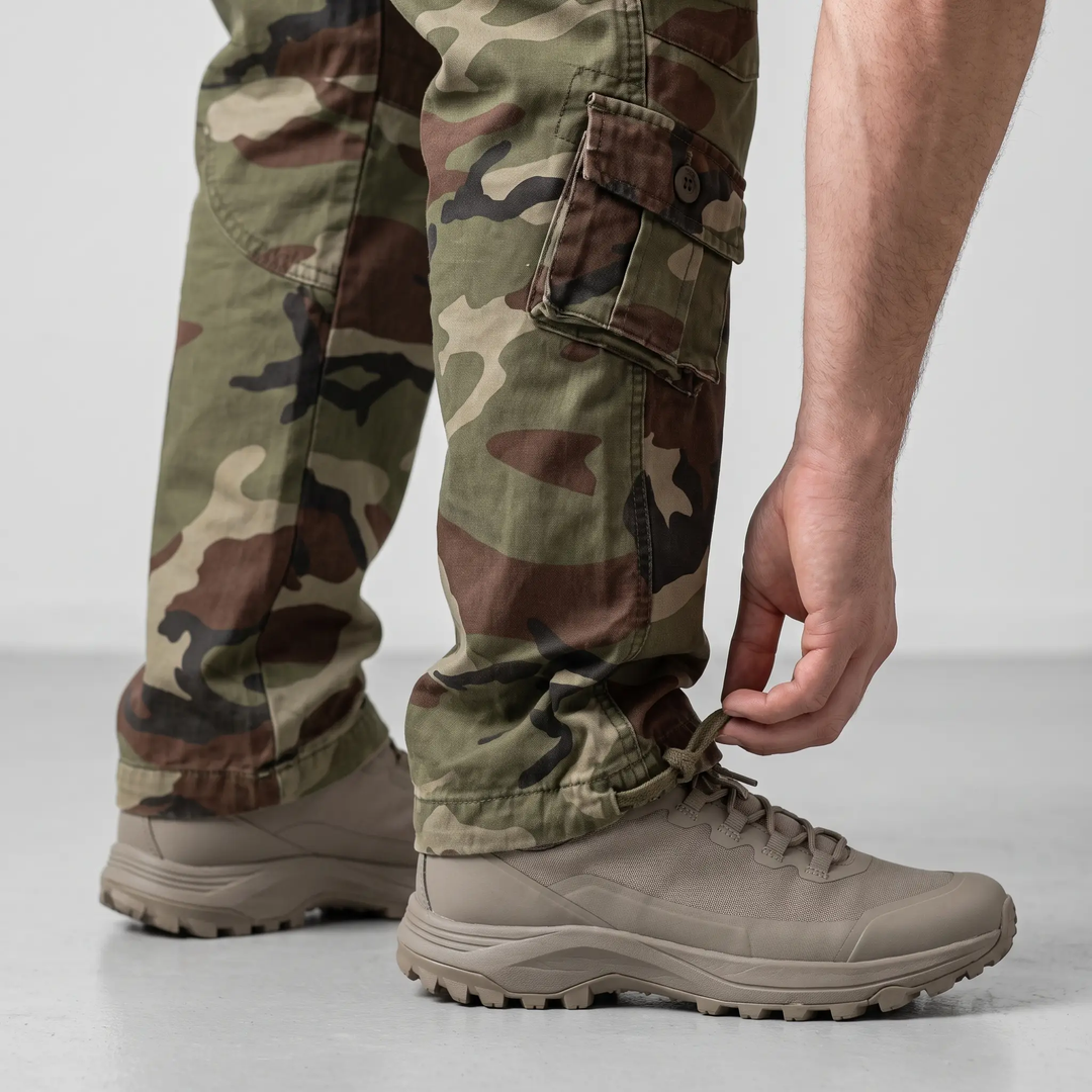 Ankle drawcord on men's camo cargo pants, close-up