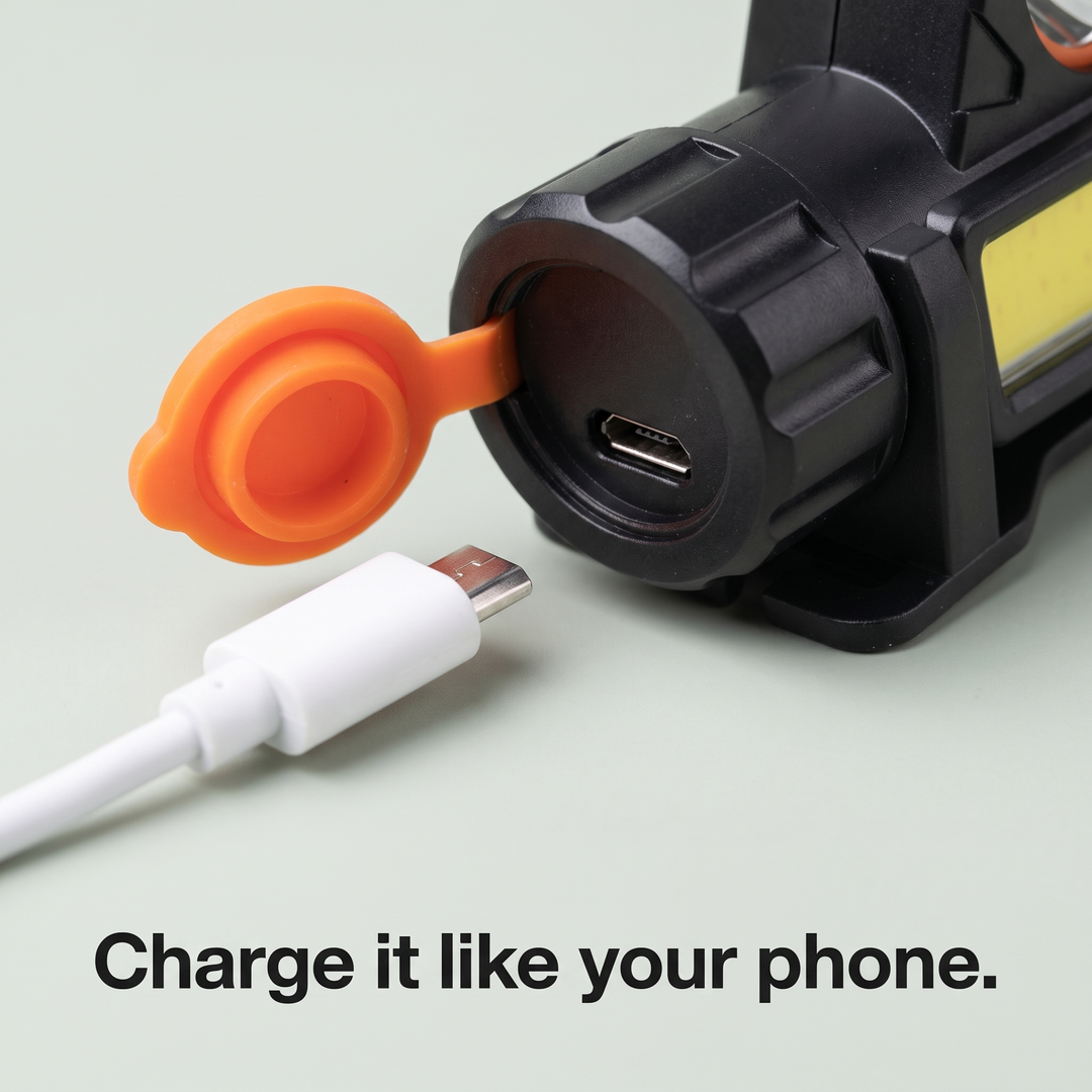 Micro-USB charging port under orange rubber cap
