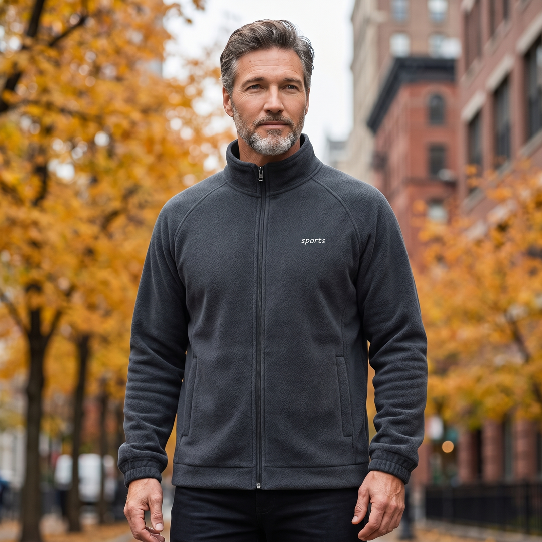 Man in autumn city park wearing dark gray fleece jacket