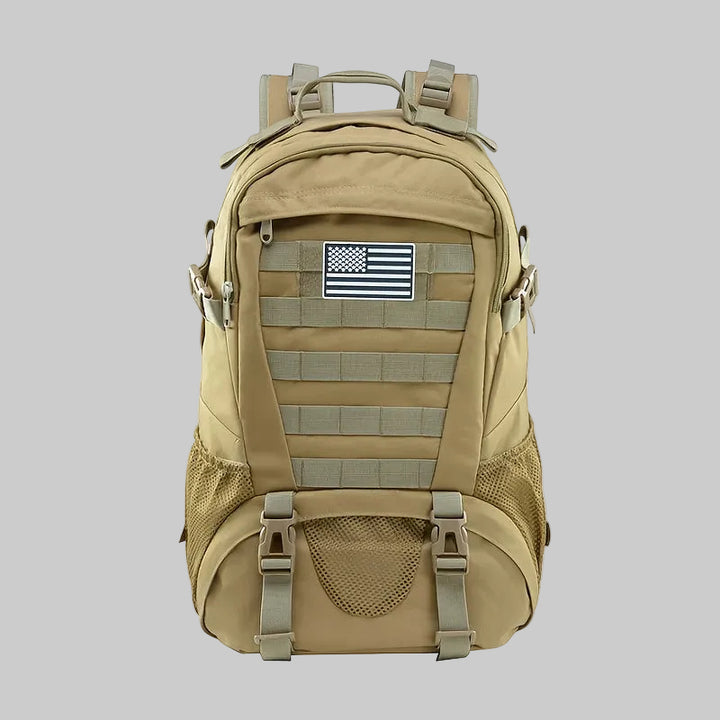 Tan backpack with American flag patch on a white background