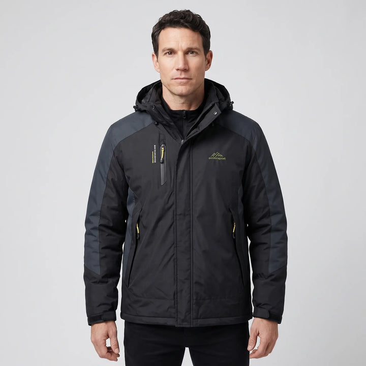 Man wearing the black insulated rain jacket in the men's cut, front view