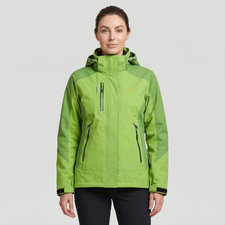 Woman wearing the green insulated rain jacket, front view, zipped with the hood down