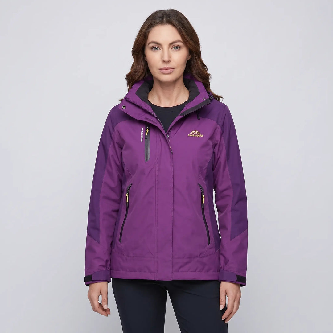 Woman wearing the purple insulated rain jacket, front view