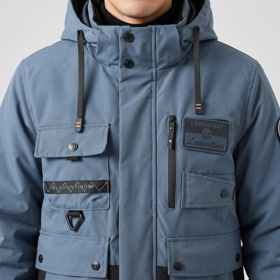 Chest pockets, storm flap snaps and D-ring on a men's hooded work jacket