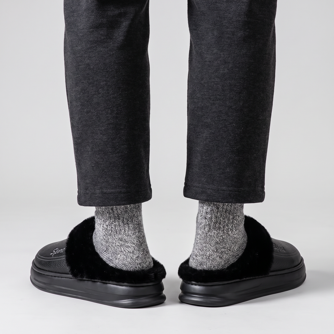 Back view of the slipper clogs worn, heels resting on the platform