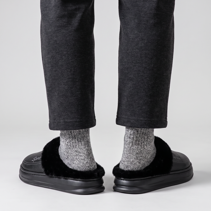 Back view of the slipper clogs worn, heels resting on the platform
