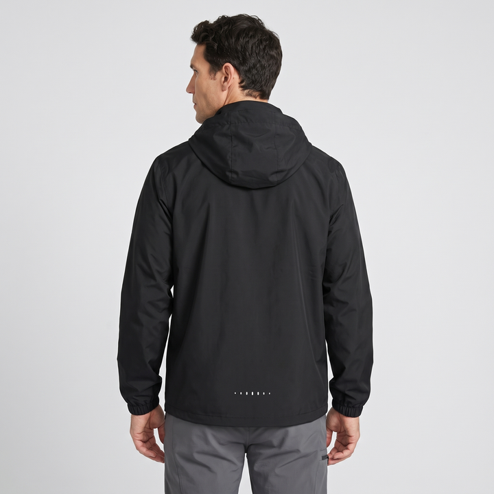 Waterproof rain jacket in Black - back view with reflective hem dots