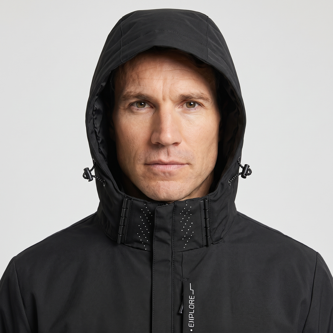 Waterproof rain jacket in Black - hood up with cord locks and hood clips