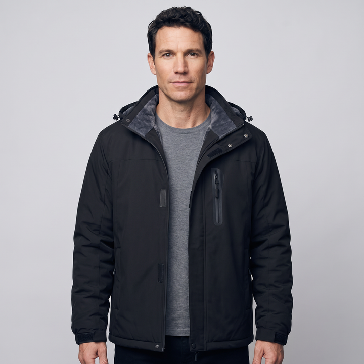 Man wearing the men's ski jacket in Black, studio front view