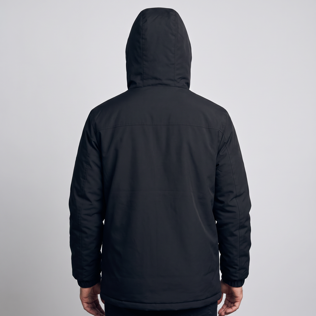 Back view of a man wearing the ski jacket with the hood up