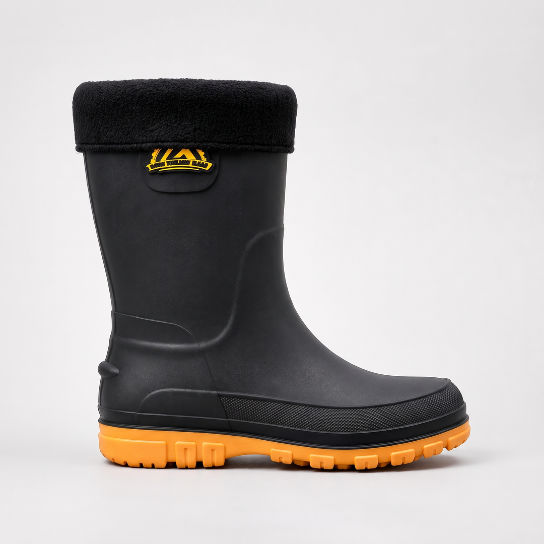 Side view of a men's fleece lined welly with the fold-down fleece cuff, side badge and yellow sole