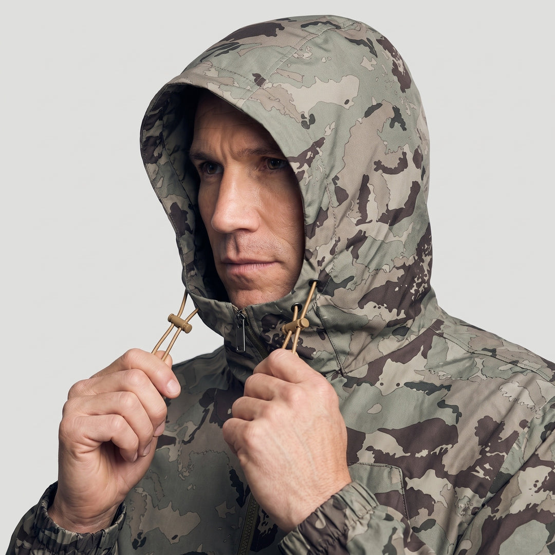 Pulling the hood drawcords on the camo jacket