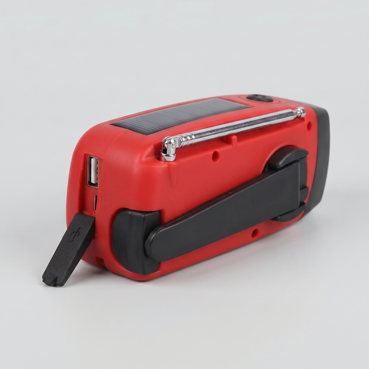 Back of the hand crank radio with folded crank and USB charging ports