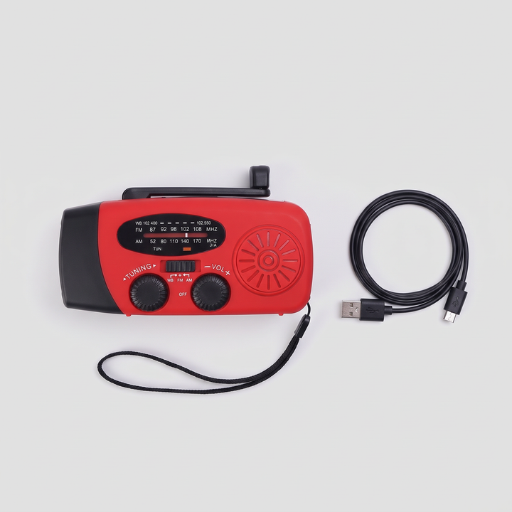 Hand crank radio with wrist strap and USB cable