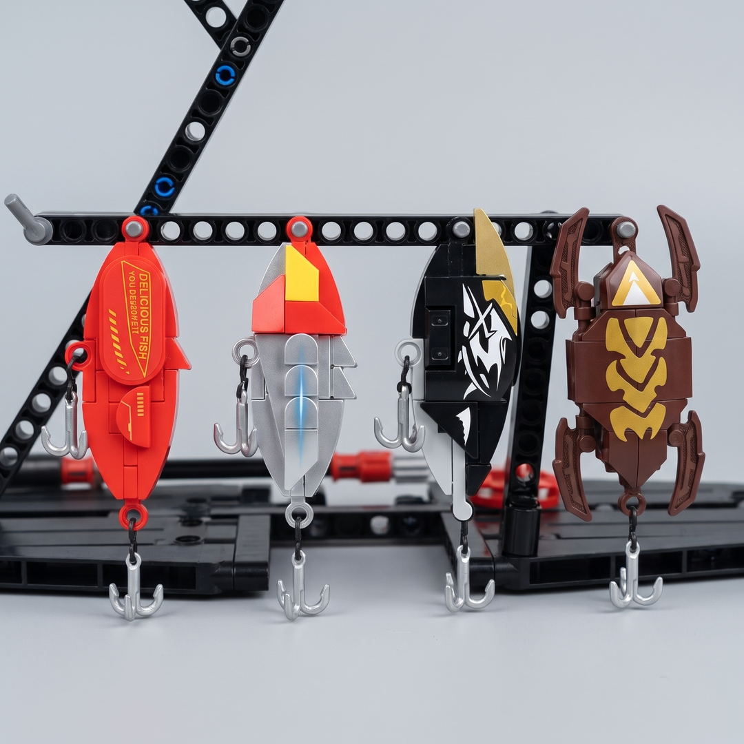 Four buildable fishing lures hanging from the stand of the building kit