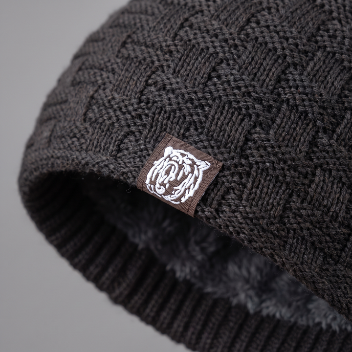 Close-up of the basketweave knit and woven tiger patch