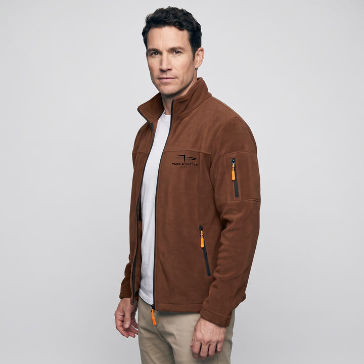 Rust fleece jacket three-quarter view showing the zip sleeve pocket