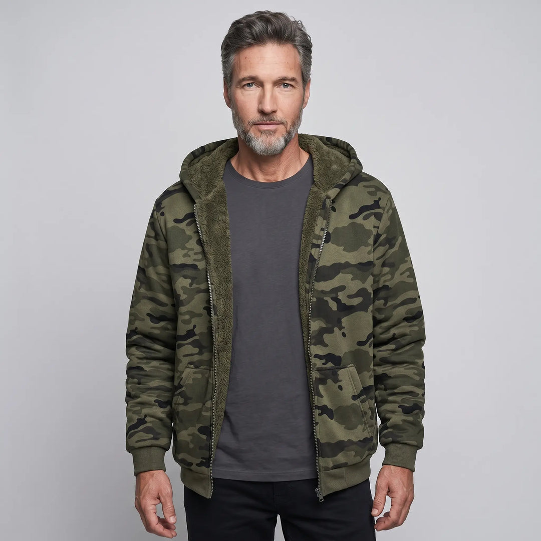 Man wearing the men's camo hoodie unzipped with the sherpa lining showing