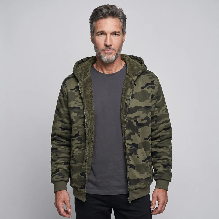 Man wearing the men's camo hoodie unzipped with the sherpa lining showing