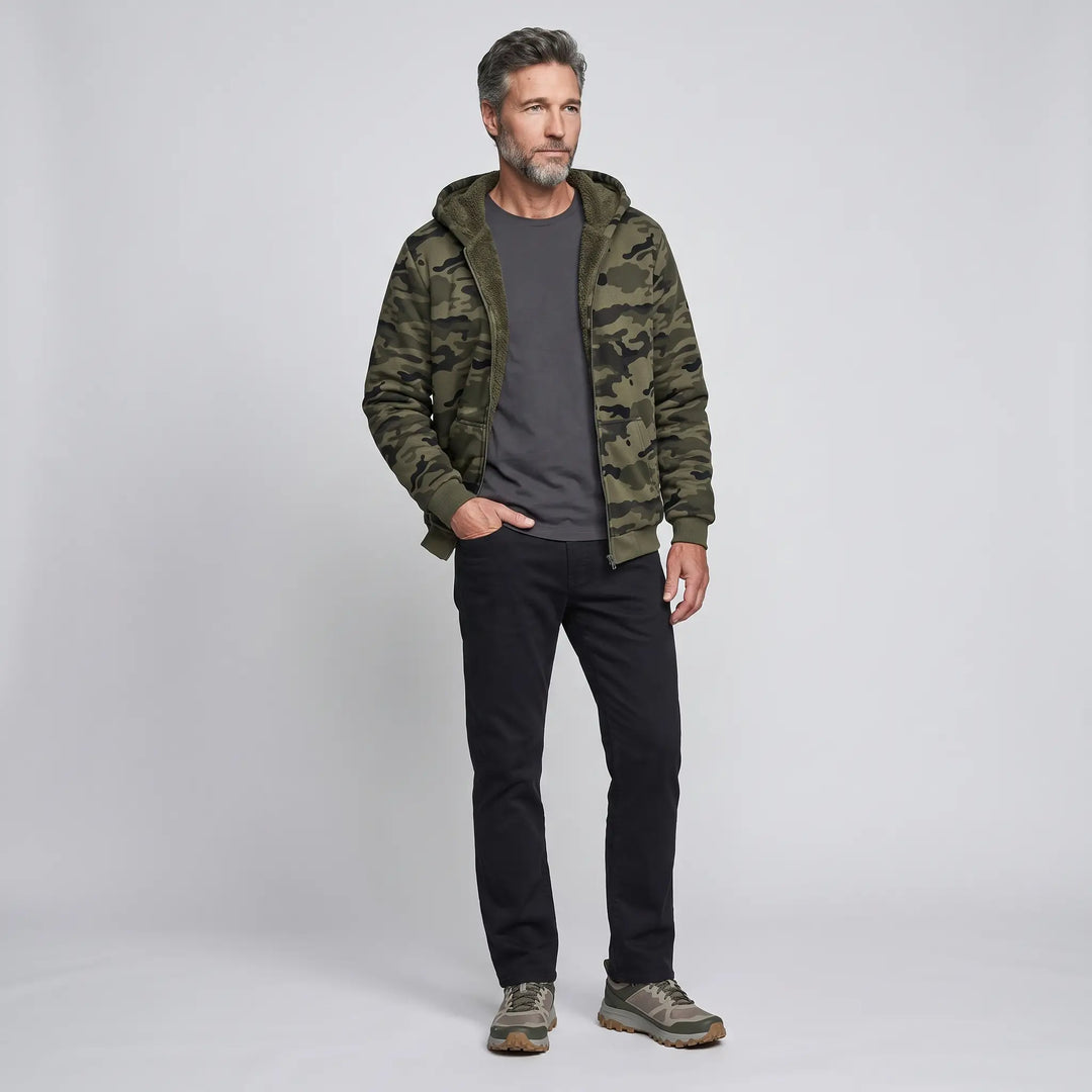 Man wearing the men's camo hoodie open over a dark tee, full body