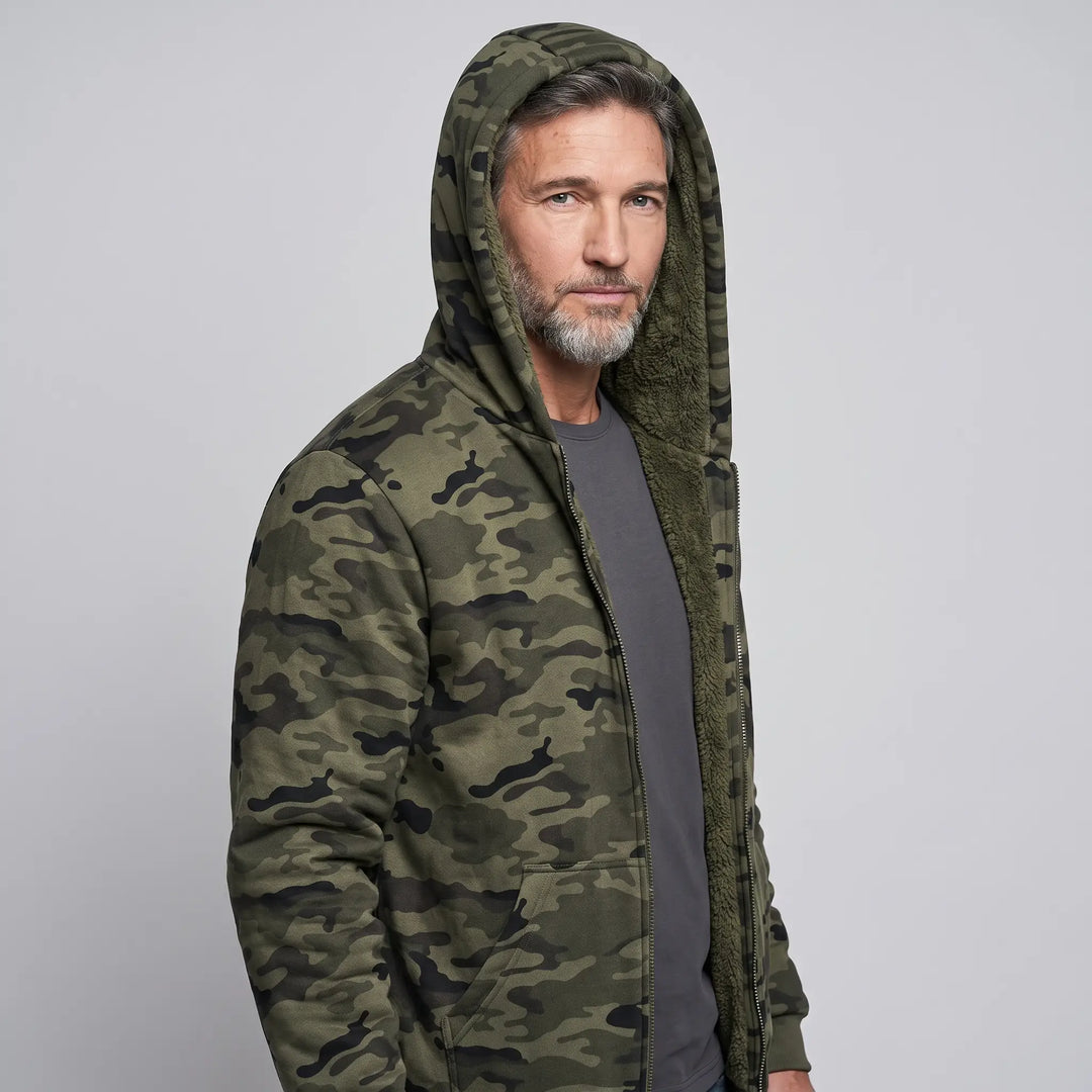 Men's camo hoodie worn with the sherpa lined hood up, three-quarter view