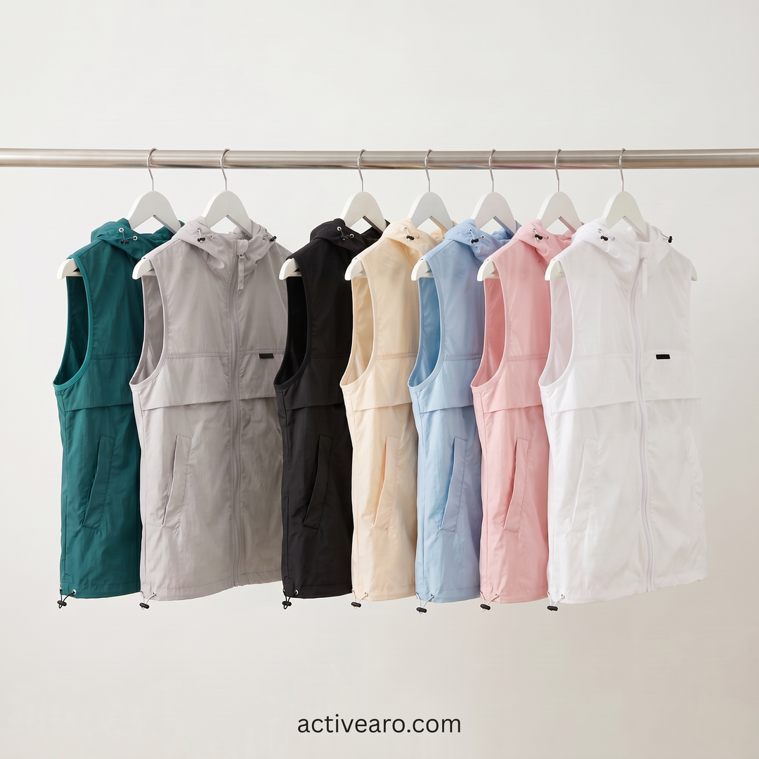 Hooded sleeveless fishing vest in all seven colors on a clothing rail