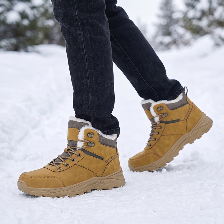Camel boots on foot mid-stride on a packed snow trail