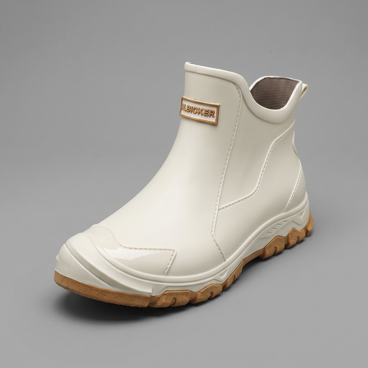 Cream PVC slip-on ankle rain boot with a gum outsole