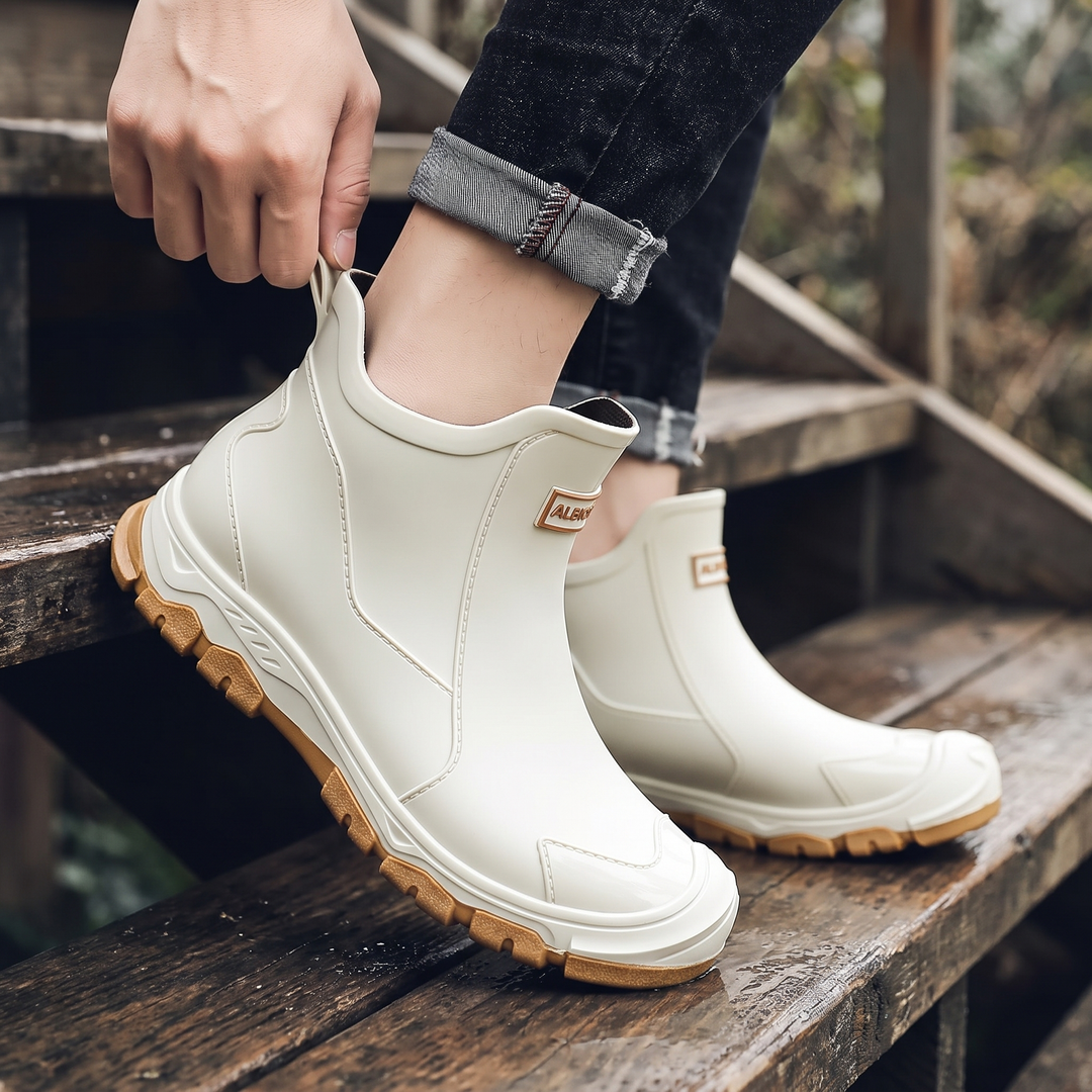 Stepping into the boot using the heel pull tab, no laces or zip