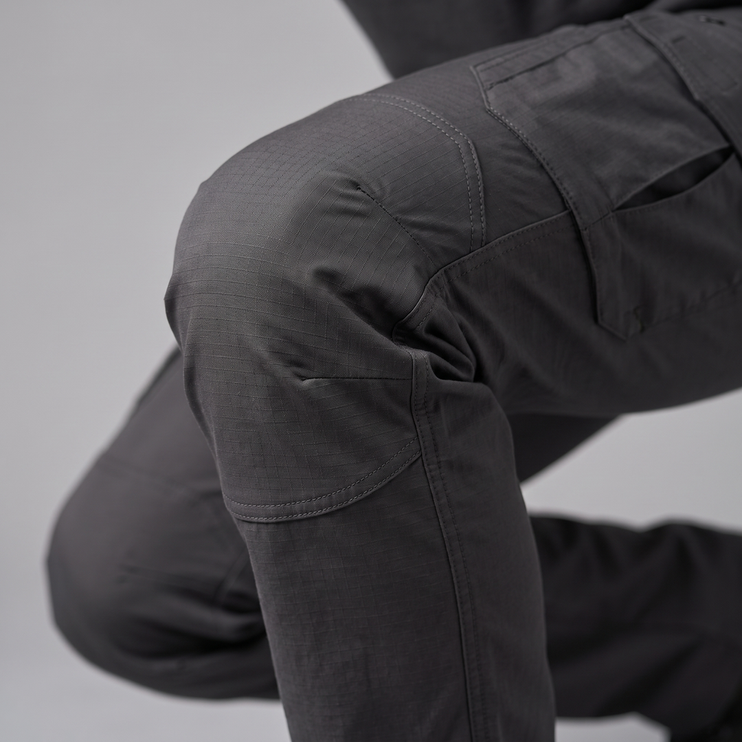 Articulated knee close-up - men's ripstop cargo pants bending without binding