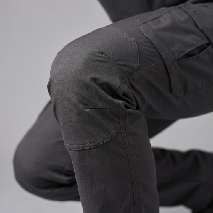 Articulated knee close-up - men's ripstop cargo pants bending without binding
