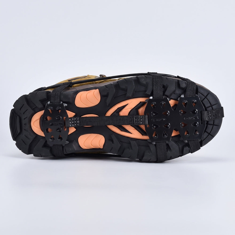 Underside of a walking boot with microspikes, spike plates under the forefoot and heel
