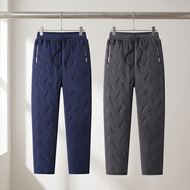 Women's fleece lined winter pants in blue and grey on hangers