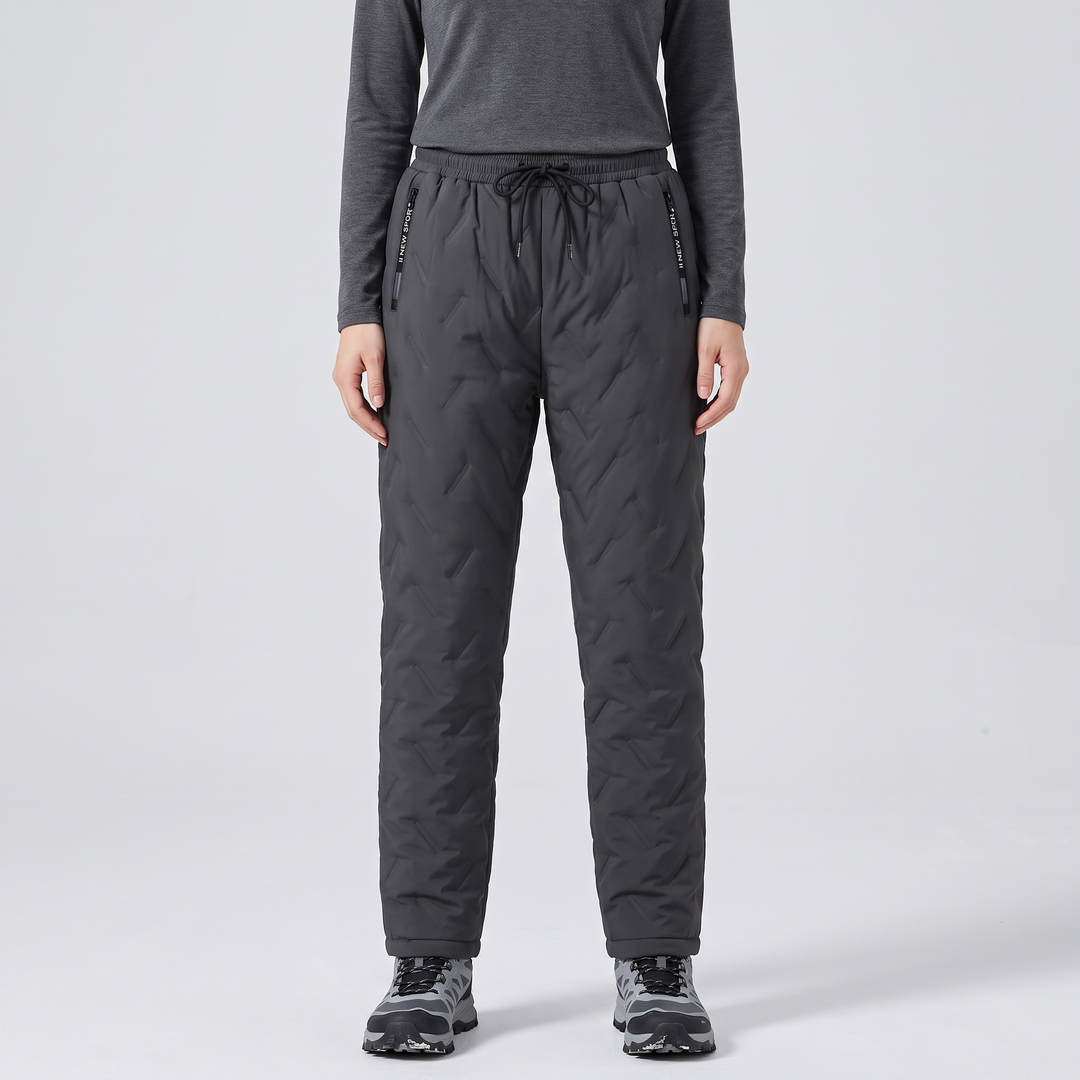 Woman wearing grey fleece lined pants, front