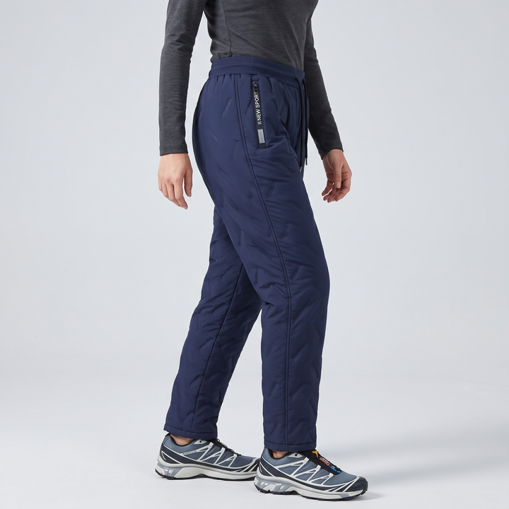 Woman wearing blue fleece lined pants, side angle